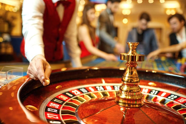 Roulette wheel and betting layout displayed on live dealer table